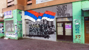 A mural in the northern half of Mitrovica glorifies Serbian soldiers who fought under the colours of the Yugoslav flag during conflict in Kosovo in 1999. ‘It is worth dying for this country,’ reads the text in Cyrillic. Photo: Stefan Milivojevic