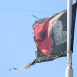 The flags of „Greater Albania“ displayed on the south and north sides of the Ibar Zastave/ zastava u Južnoj Mitrovici